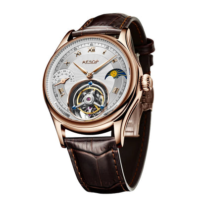 A luxury wristwatch by Aesop featuring a rose gold case, a brown leather strap, and a detailed silver-toned dial with a visible tourbillon and moon phase indicator.