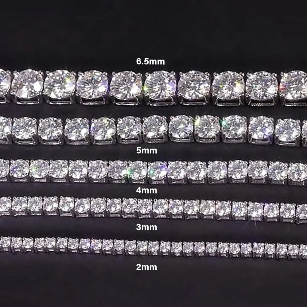 Set of diamond-studded earrings with varying sizes on a black background