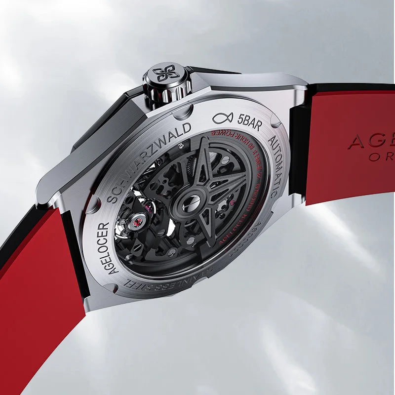 Watch with red strap and silver case on a white background