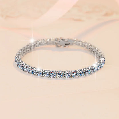 Silver bracelet with clear stones on a beige background