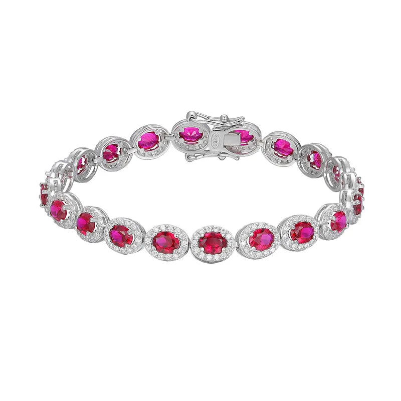Silver bracelet with pink gemstones on a white background