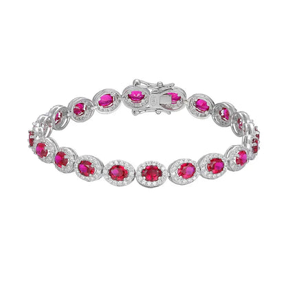 Silver bracelet with pink gemstones on a white background