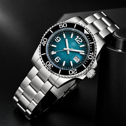 A stainless steel wrist watch with a blue-green dial, black rotating bezel, and silver metal bracelet, shown resting on a dark textured surface with a camera strap in the background. The brand ADDIESDIVE is printed on the dial and as a logo in the top-left corner.