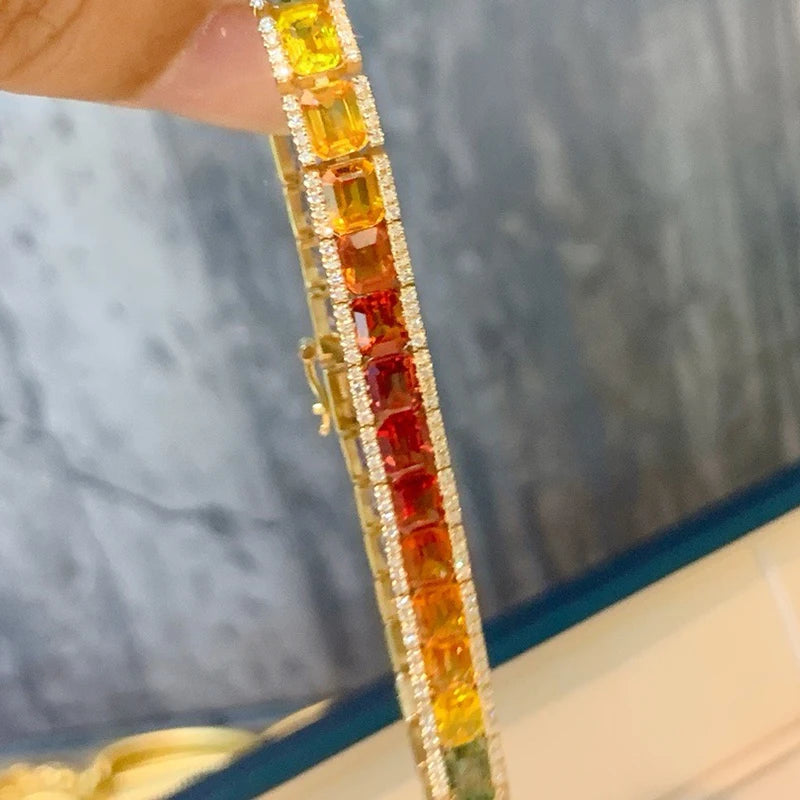 Close-up of a bracelet with colorful gemstones against a blurred background