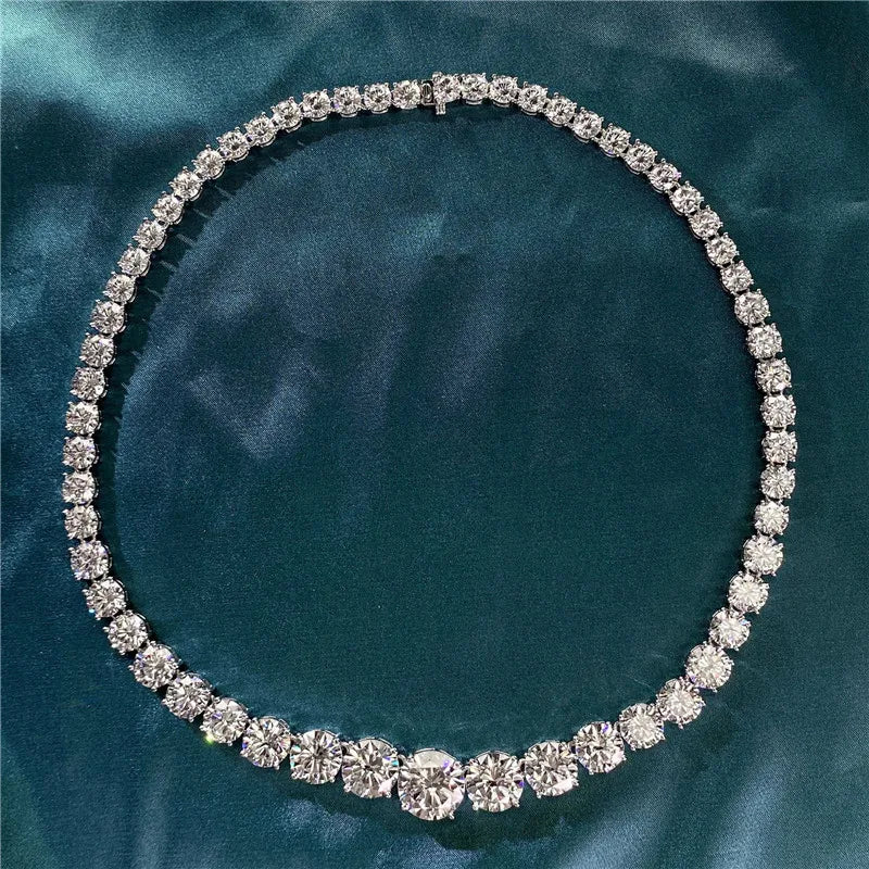 Diamond necklace on a teal fabric background