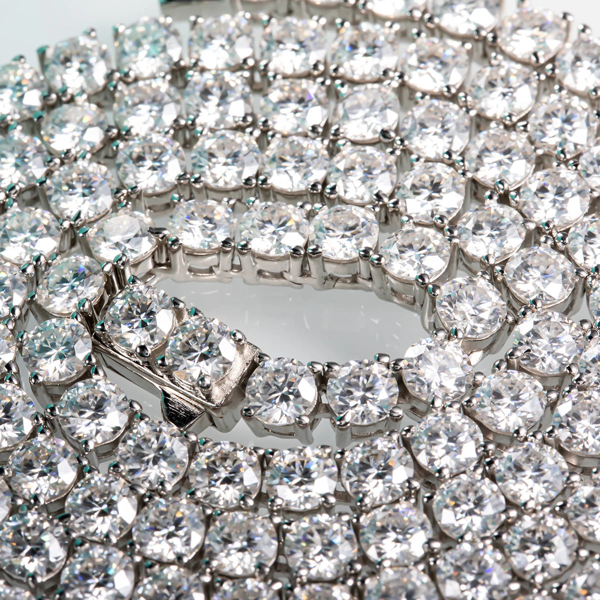 Close-up of a diamond bracelet with clear stones on a white background