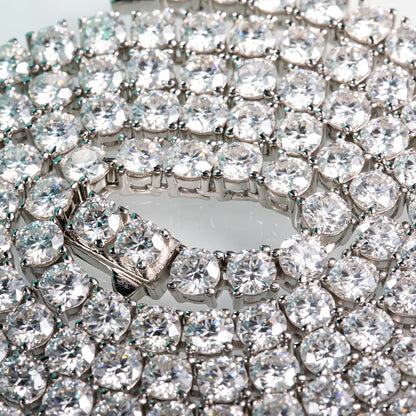 Close-up of a diamond bracelet with clear stones on a white background