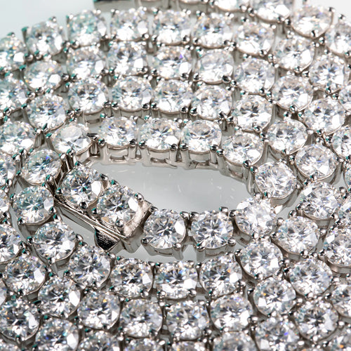 Close-up of a diamond bracelet with clear stones on a white background