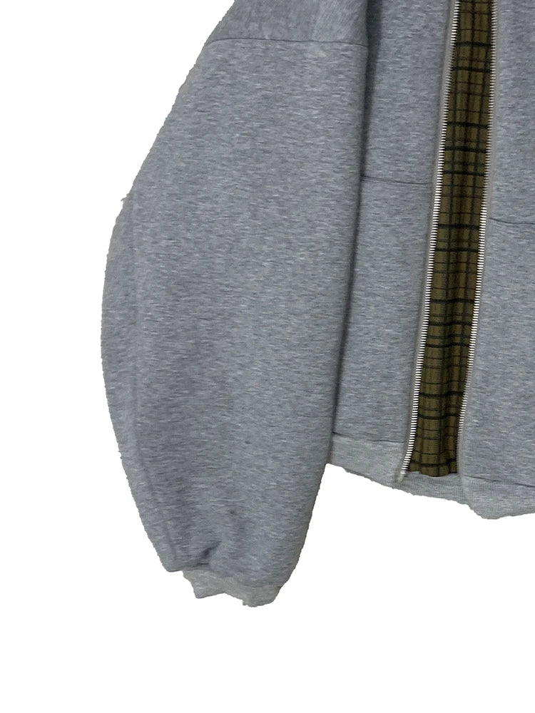 Gray sweatshirt with plaid lining on a white background