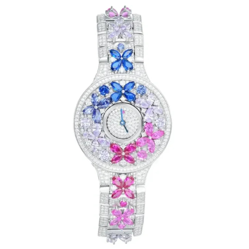 Decorative watch with colorful butterfly-shaped gemstones on a white background