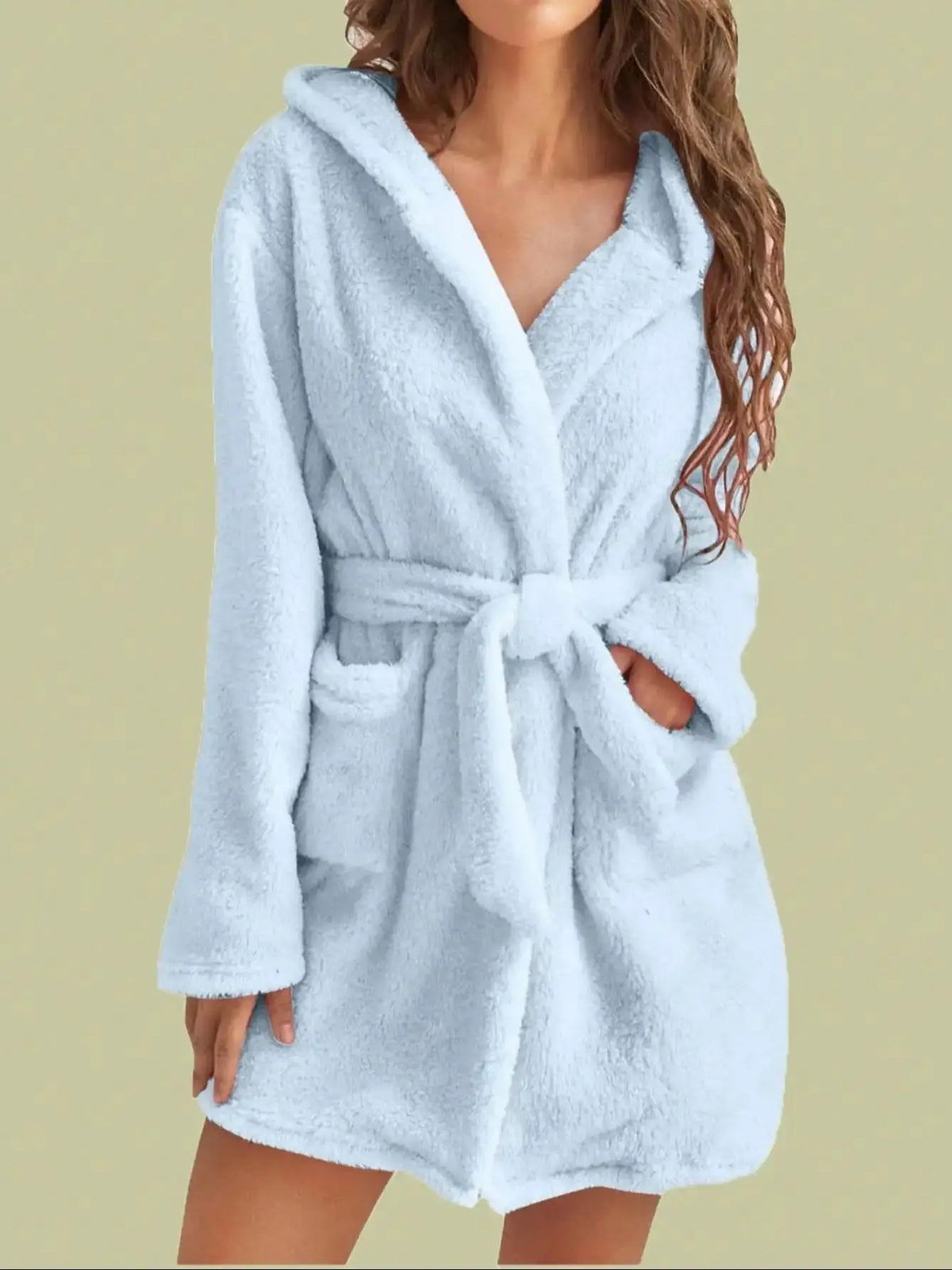 Light blue robe worn by a person on a beige background