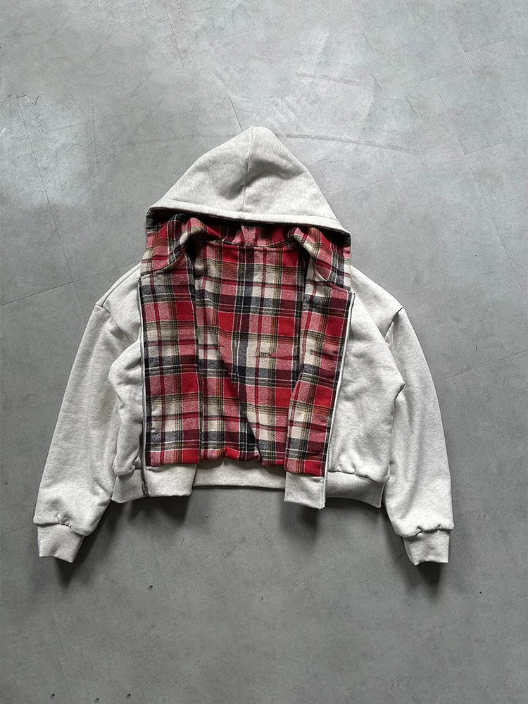 Gray hoodie with plaid lining on a gray background