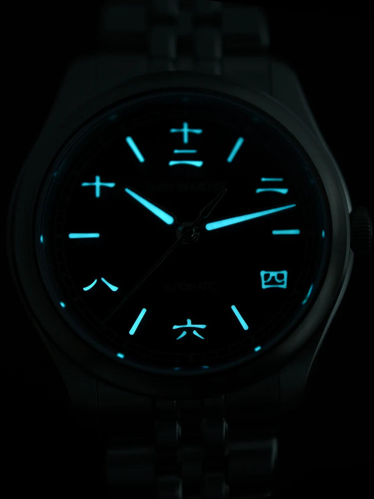 Watch with glowing blue face on a dark background