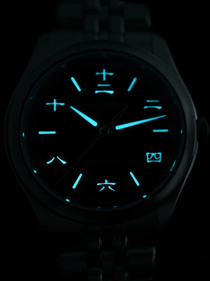 Watch with glowing blue face on a dark background