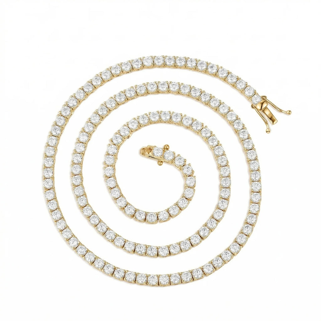 A yellow gold tennis necklace with a continuous row of round-cut clear gemstones, arranged in a spiral on a solid white background.