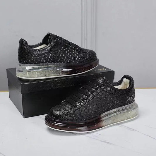 Black textured sneakers on a white surface with a gray background