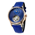 A luxury wrist watch featuring a vibrant blue textured dial, a visible mechanical movement through a cutout, and a matching blue leather strap with a rose gold case.