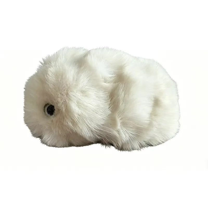 A fluffy white faux fur rabbit toy with a single black eye, shown against a plain white background.