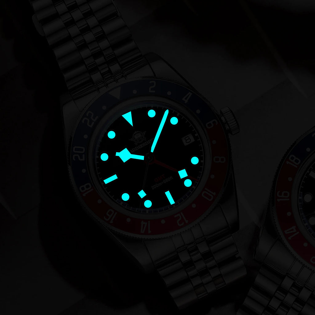 Watch with a glowing blue face on a dark background