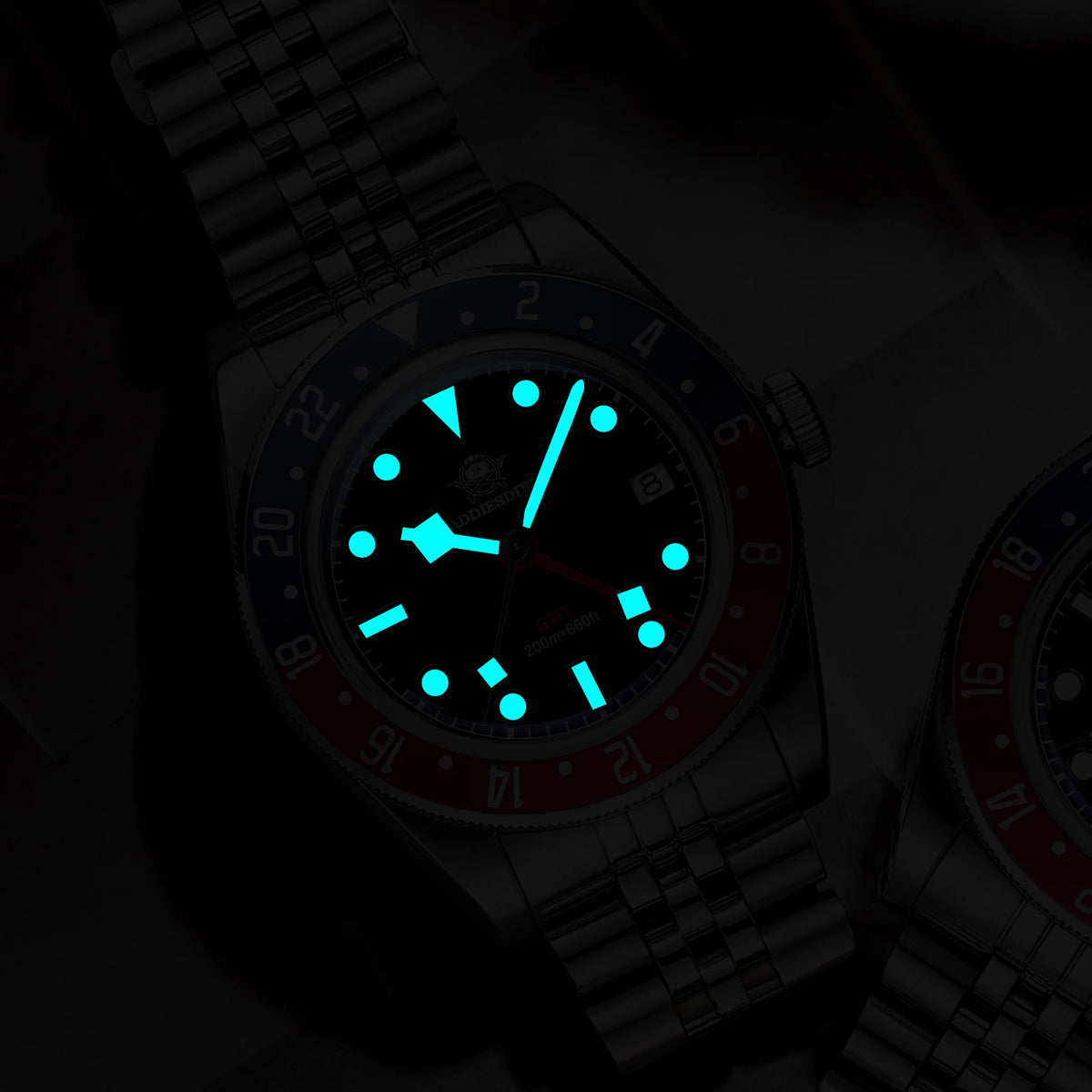 Watch with a glowing blue face on a dark background