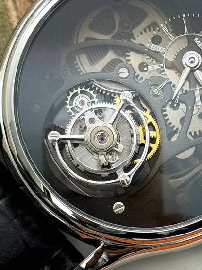 Close-up of a mechanical watch with visible gears and components.