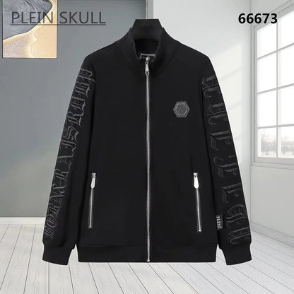 A black zip-up jacket with silver zippers and tonal black gothic lettering on both sleeves, displayed on a mannequin against a gray and white interior background. The brand name 'PLEIN SKULL' is visible in the top left corner.