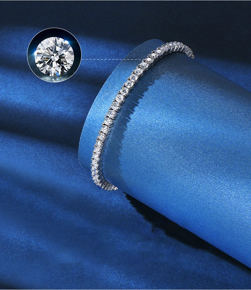 Diamond bracelet on a blue fabric background with a close-up of a diamond.