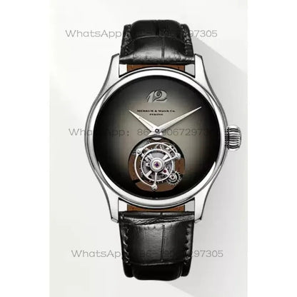 A luxury wristwatch with a polished silver-tone case, a dark gray to black gradient dial, and a visible tourbillon movement on the lower half of the dial. It is fitted with a black alligator-pattern leather strap.