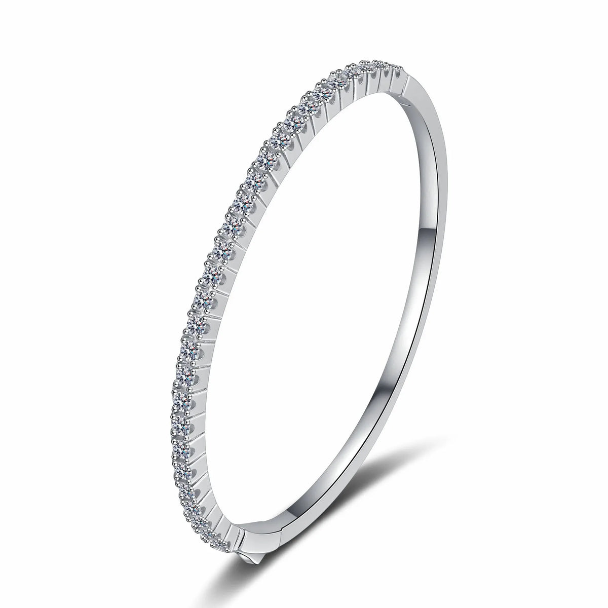 A slim silver-toned bangle bracelet featuring a single row of small clear stones along the outer band, shown on a clean white background.