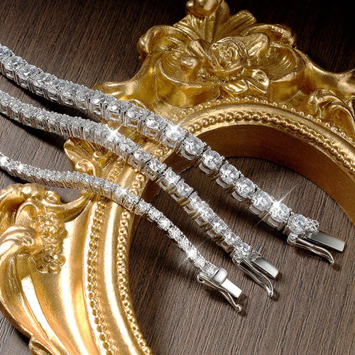 Silver bracelet with diamonds on a wooden surface with gold decorative elements