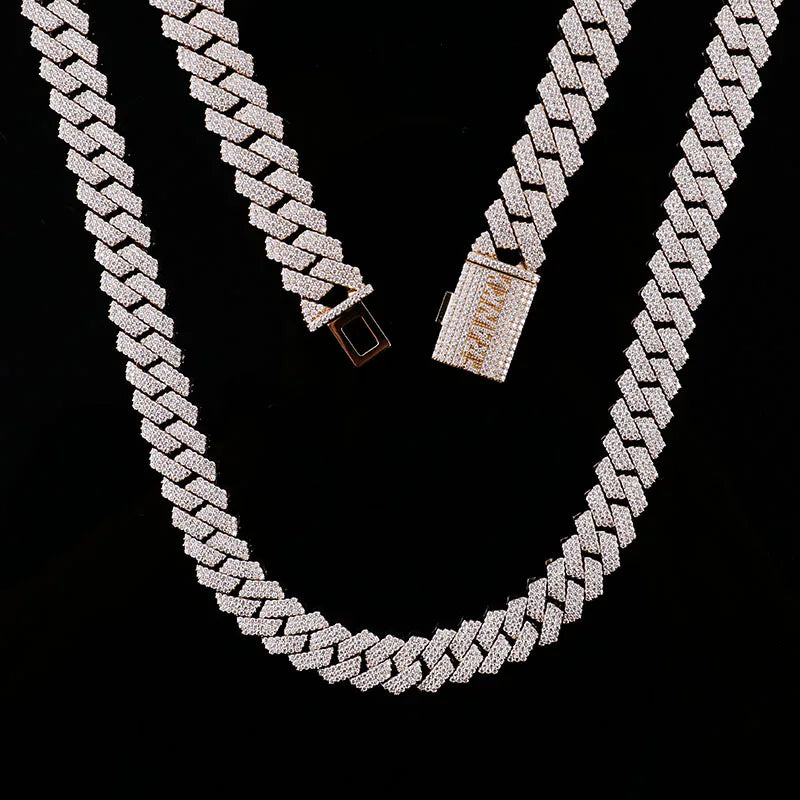 Silver chain necklace with a clasp on a black background