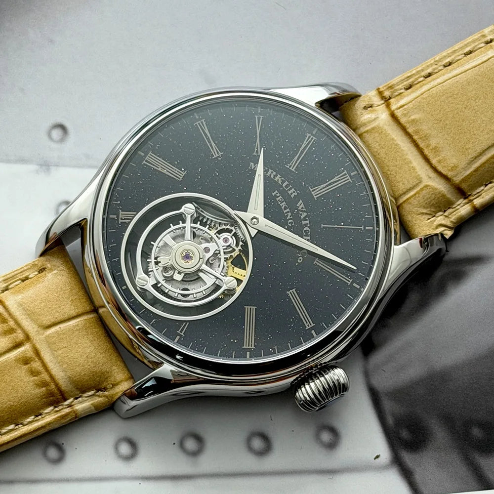 Luxury watch with beige leather strap on a gray background