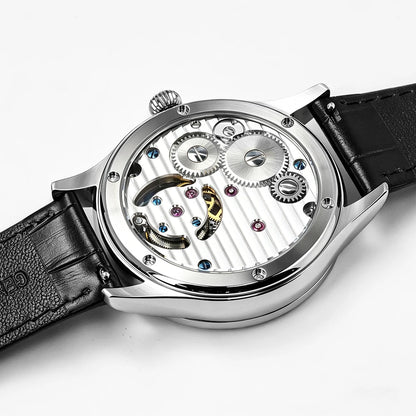Luxury watch with black leather strap and visible mechanical components on a white background