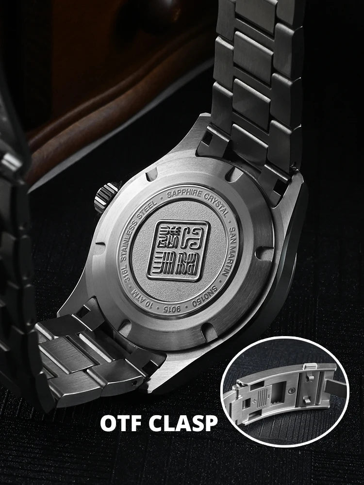Close-up of a watch with OTF clasp mechanism on a dark background