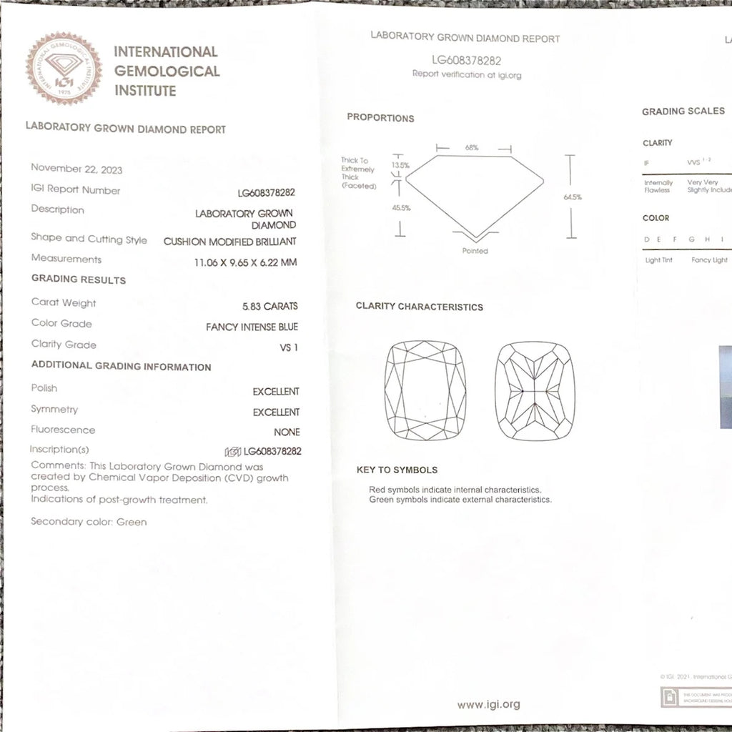 A folded laboratory gemstone report page from the International Gemological Institute, showing diamond grading information, proportions, clarity characteristics, and a key to symbols for a laboratory grown diamond.