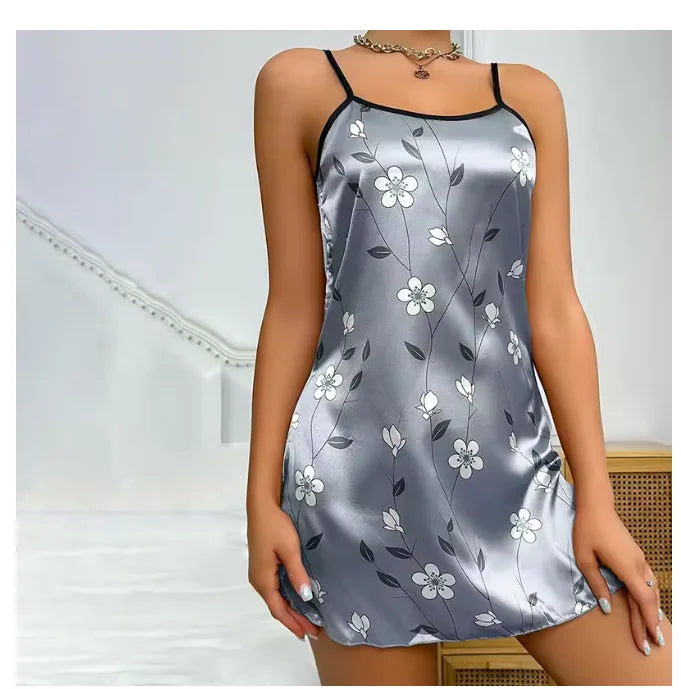 Silver satin nightgown with floral pattern worn by a model against a neutral background