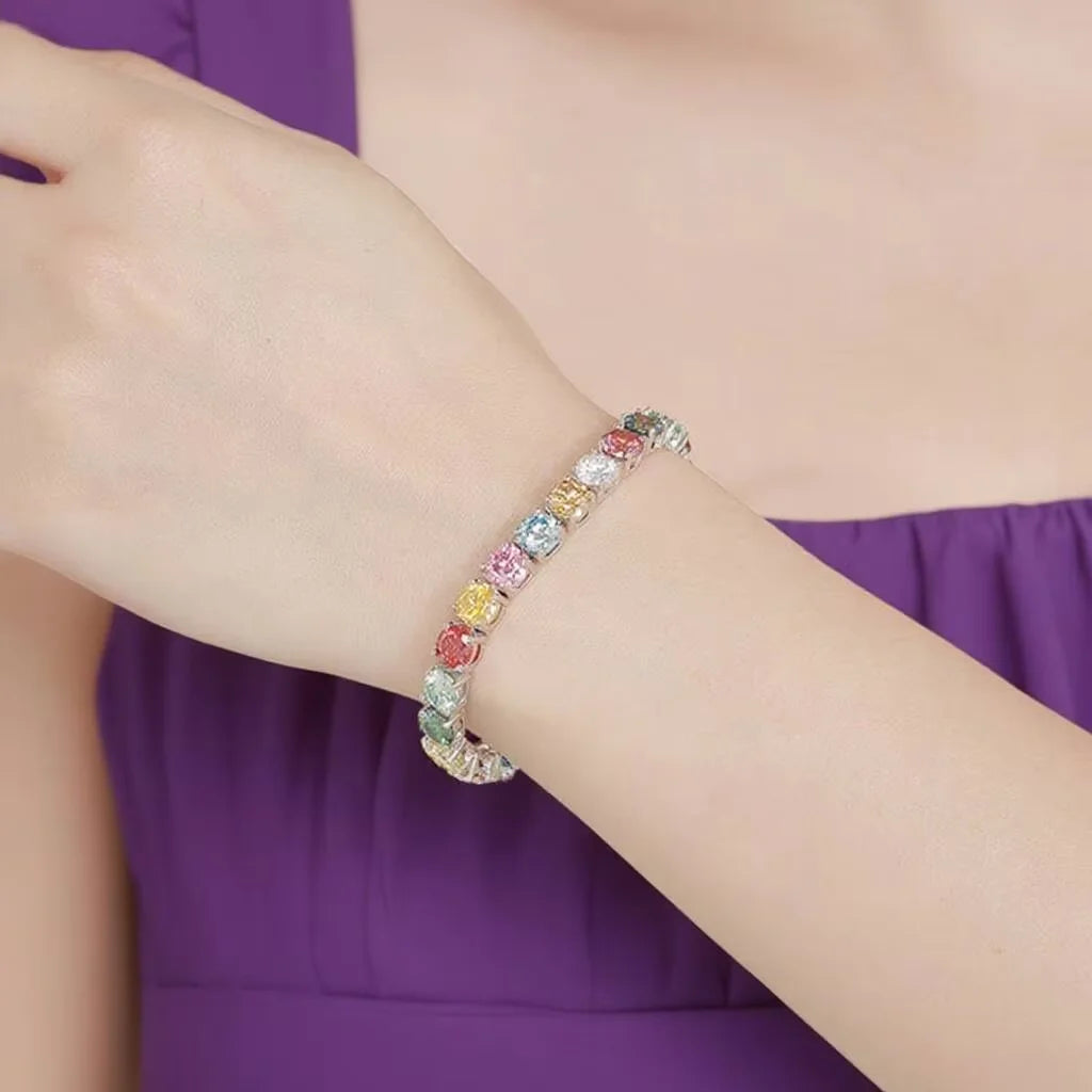 Multicolored beaded bracelet on a person's wrist with a blurred purple background