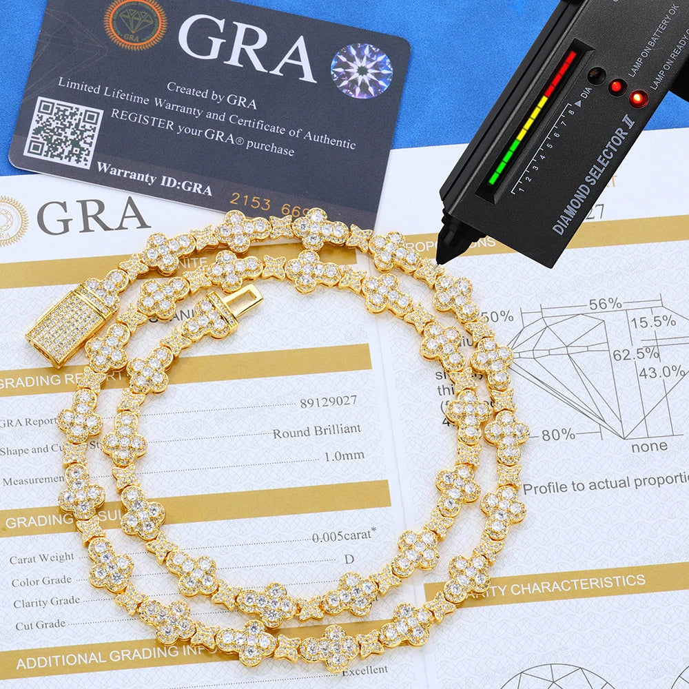 Gold bracelet with diamonds on a diamond grading report and GRA card.
