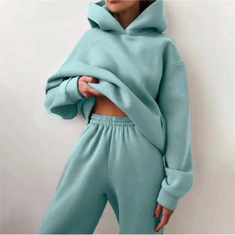 Light blue hoodie and sweatpants set on a plain background