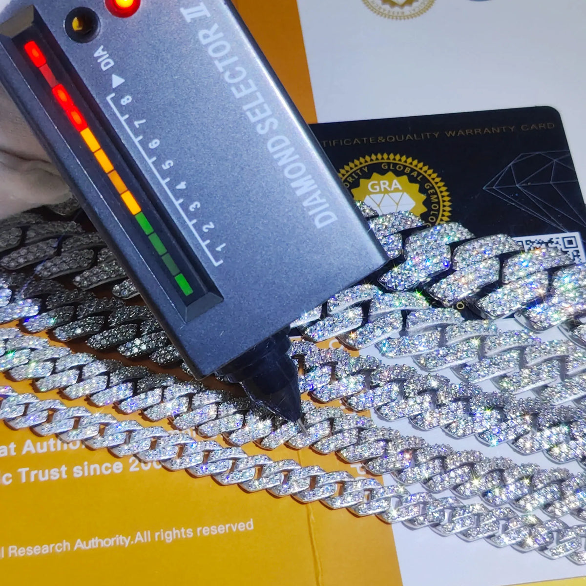 Diamond selector tool on a diamond chain with a grading card in the background