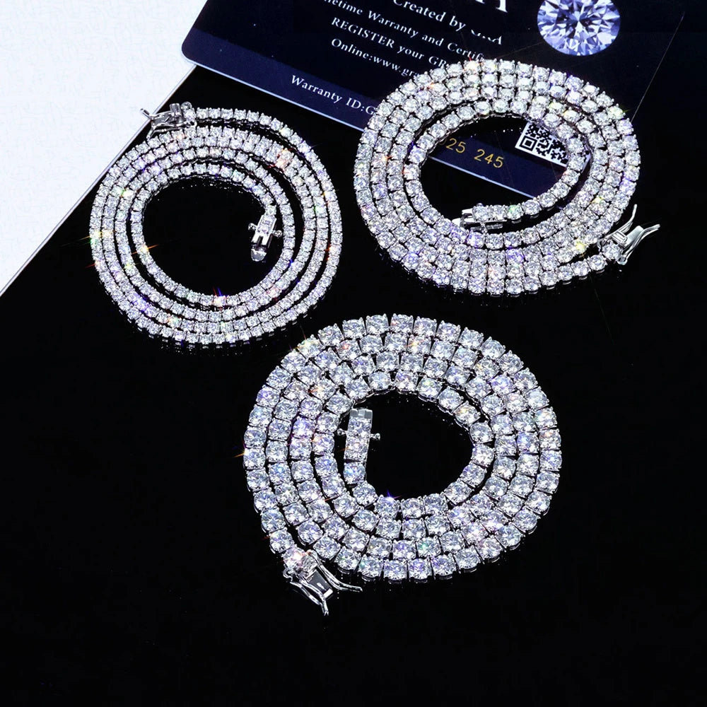 Three diamond necklaces on a black background with a warranty card.