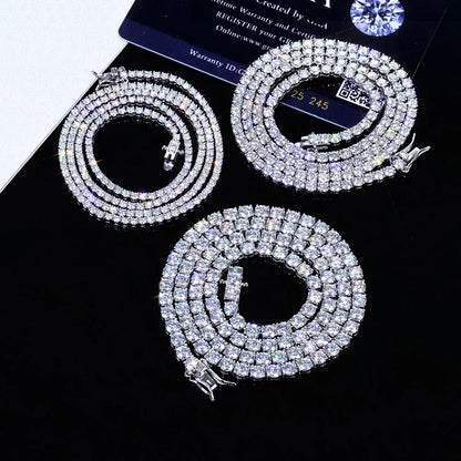 Three diamond necklaces on a black background with a warranty card.