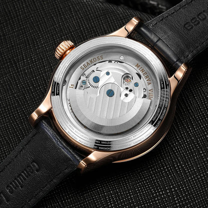 Close-up of a watch with a visible brand name on a textured black background