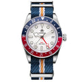 Watch with a blue and red bezel and multicolored strap on a white background