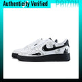 A pair of white and black Nike Air Force 1 Low sneakers decorated with black cat illustrations, shown against a white background with a teal border and an 'Authenticity Verified' banner at the top.