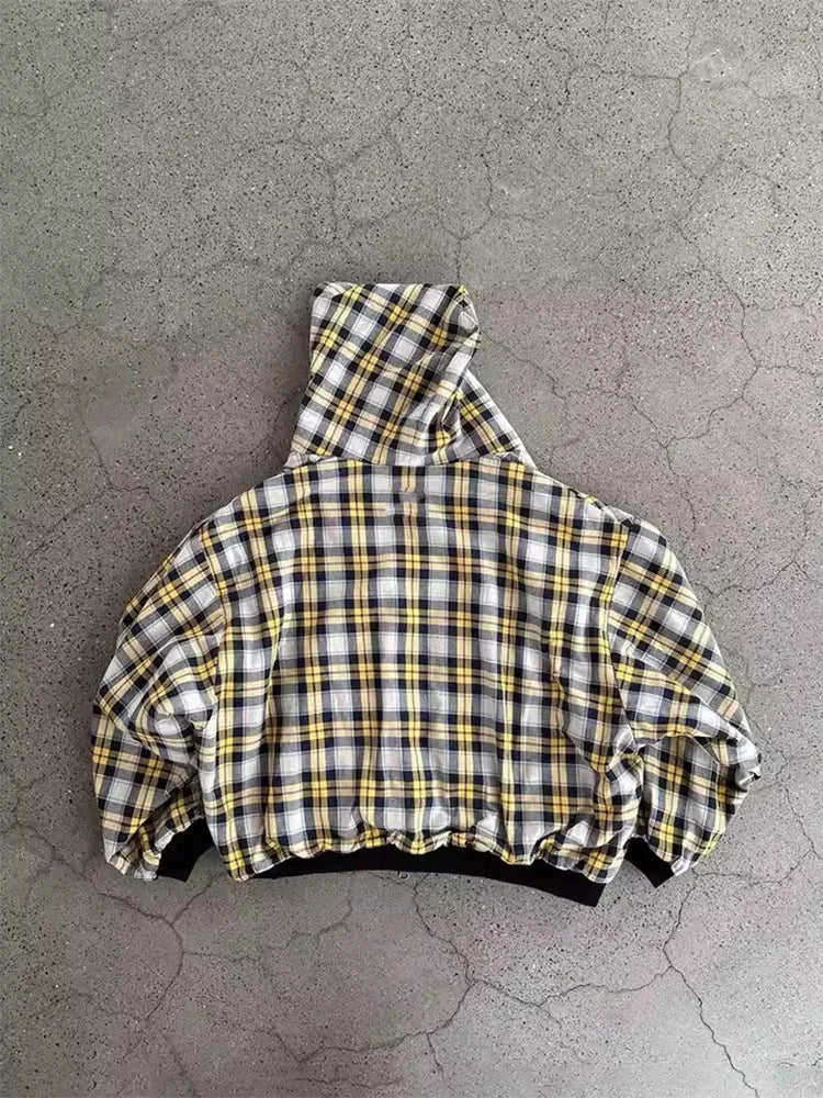 Plaid jacket on a textured gray surface