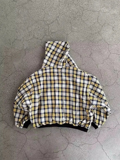 Plaid jacket on a textured gray surface