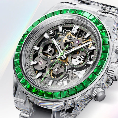 A luxury skeleton watch with a silver-tone stainless steel case, featuring a bezel lined with vivid green gemstones and a complex multi-dial mechanical movement visible through the open dial.