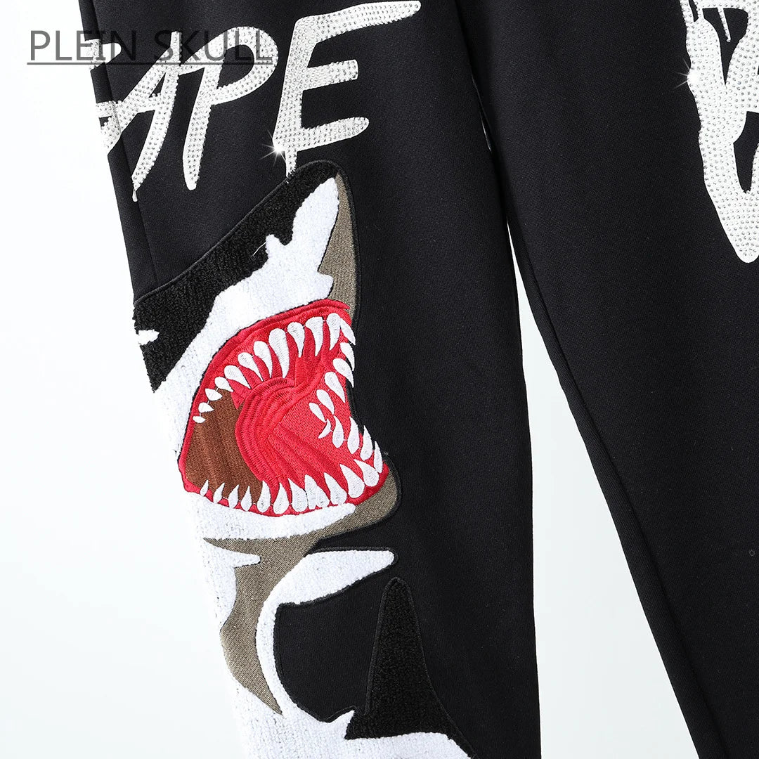 Black jacket with shark mouth design and 'Plein Skull' branding