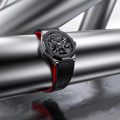 Luxury watch with black and red strap on metallic surface